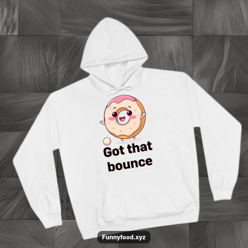 Funny donut hoodie with a delighted donut character happily bouncing a small ball, radiating warmth and happiness.